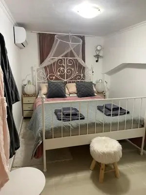 a bedroom with a bed with a canopy at Casa Fiore, Rhodes in Rhodes Town