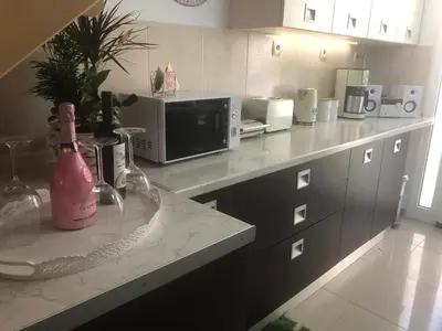 a kitchen with a counter top with a microwave at Casa Fiore, Rhodes in Rhodes Town