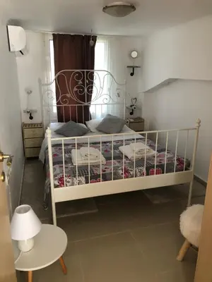 a bedroom with a white bed in a room at Casa Fiore, Rhodes in Rhodes Town