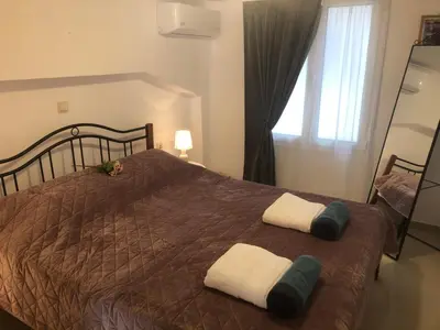 a bedroom with a bed with two towels on it at Casa Fiore, Rhodes in Rhodes Town