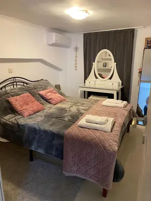 a room with two beds with a mirror and a vanity at Casa Fiore, Rhodes in Rhodes Town