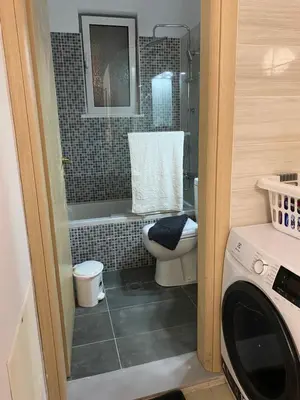 a small bathroom with a toilet and a sink at Casa Fiore, Rhodes in Rhodes Town