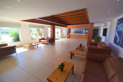 a large living room with couches and a table at LINDOS GARDENS RESORT COMPLEX in Líndos
