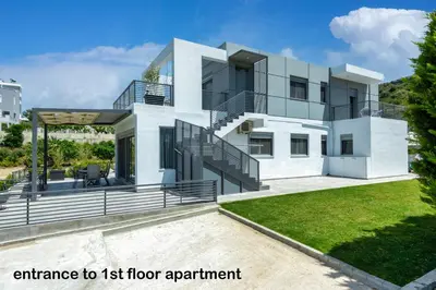 an image of a house with an entrance to its floor apartment at Wonderview Exclusive Apartment in Kremasti