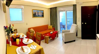 a living room with a couch and a table at A&B Rhodes city apartments in Rhodes Town