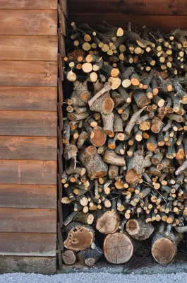 a wooden box filled with logs and other objects at Echo Traditional House - Ηχώ Παραδοσιακό Σπίτι in Émbonas
