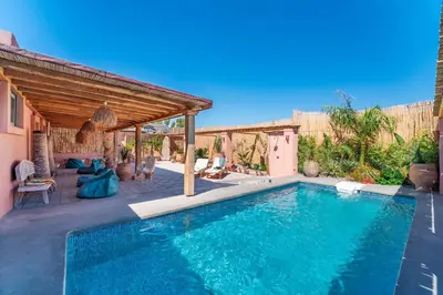 a swimming pool in a backyard with a house at Onar Villa Kolympia in Kolimbia