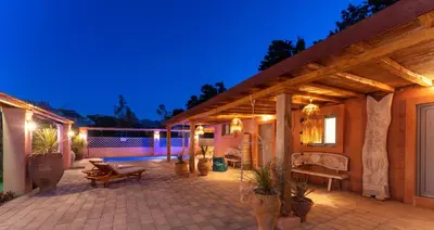a house with a patio at night with lights at Onar Villa Kolympia in Kolimbia