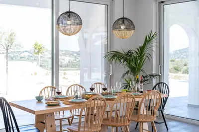 a dining room with a table and chairs at Nora Villa in Afantou