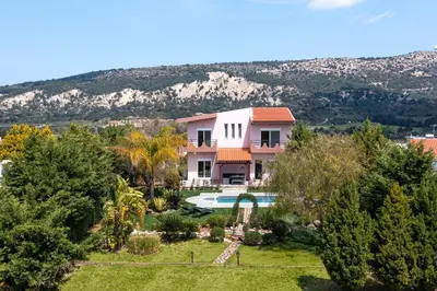 an aerial view of a house with a swimming pool at Zenia Villa in Paradeísion