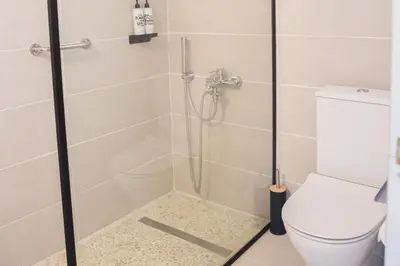 a bathroom with a shower with a toilet at Ladiko Inn Hotel Faliraki -Anthony Quinn Bay in Faliraki
