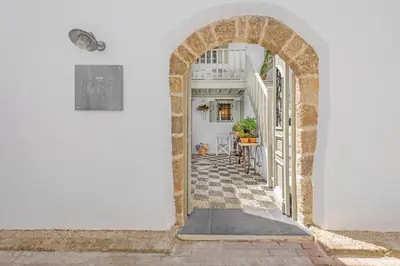 an archway leading down a street in positanoolisolisolisolisolisolis at Amarada City Suites in Rhodes Town