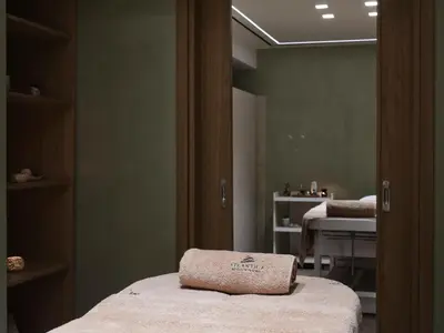 a room with two beds and a mirror at Atlantica Princess Hotel in Ixia