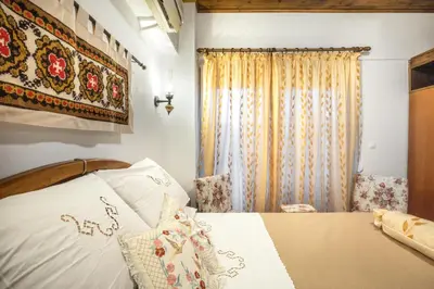 a bedroom with a bed and a window at Margarita luxury apartment 2 in Faliraki