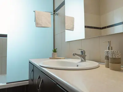 a bathroom with a sink and a mirror at Adonis Villa in nature in Ixia