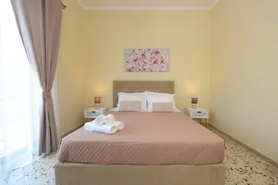 a bedroom with a bed with towels on it at Alion House in Rhodes Town