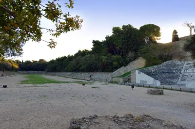 an empty amphitheater with a building in the background at Alion House in Rhodes Town