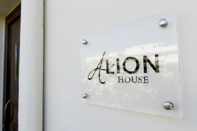 a sign on the door of a iron house at Alion House in Rhodes Town
