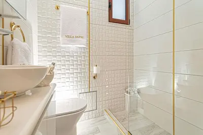 a bathroom with a sink and a toilet at Villa Dafni - Lindos in Líndos