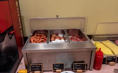a food cart with eggs and other food items at Marine Congo Hotel in Rhodes Town