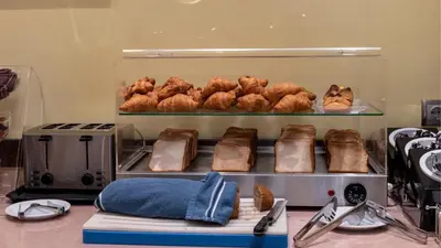 a bakery with a bunch of pastries and bread at Marine Congo Hotel in Rhodes Town