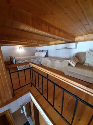 an overhead view of a room with a couch and a bed at Casa Nikolou Halki in Halki