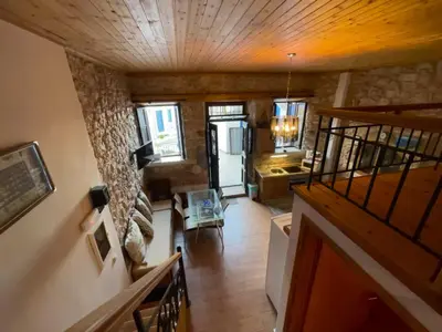 an overhead view of a living room with a staircase at Casa Nikolou Halki in Halki