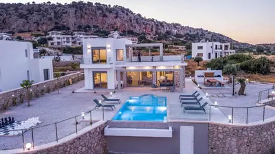 a villa with a swimming pool and a house at Your House In Rhodes in Afantou