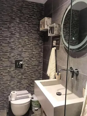 a bathroom with a sink and a toilet and a mirror at Joanna Apartments in Haraki