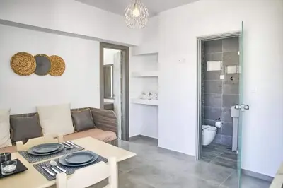 a living room with a couch and a table at Joanna Apartments in Haraki