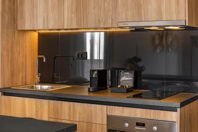 a kitchen counter with a sink and a microwave at Amarada Marina Suites in Rhodes Town