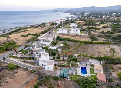 an aerial view of a village next to the ocean at Memi Beach front Villa in Kiotari