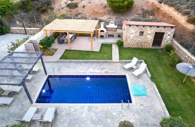 an overhead view of a swimming pool in a backyard at Memi Beach front Villa in Kiotari