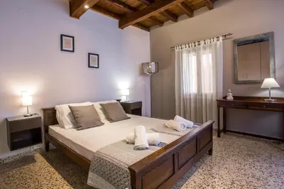 a bedroom with a bed with two towels on it at Anna's house in the Old Town in Rhodes Town