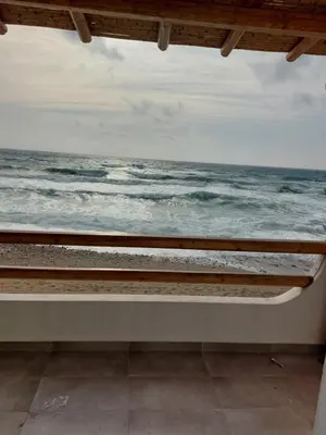 a view of the ocean from a window at Ammos stegna in Archangelos