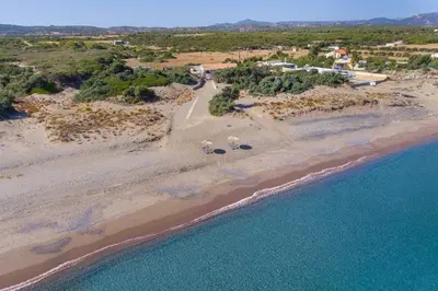 an aerial view of a beach and the ocean at Cathrin Beachfront Villa in Plimmiri