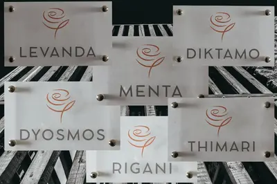 a group of signs on the side of a building at Kipos Suites & Apartments in Gennadi