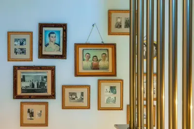 a wall with pictures of people on it at Kipos Suites & Apartments in Gennadi