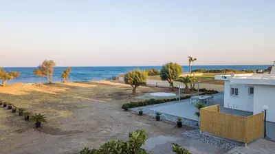 an aerial view of a house and the ocean at Celini beach house in Kiotari