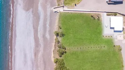 an overhead view of a beach and the ocean at Celini beach house in Kiotari