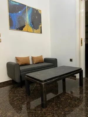 a living room with a couch and a coffee table at NJ Apartments: The Island Edition in Rhodes Town