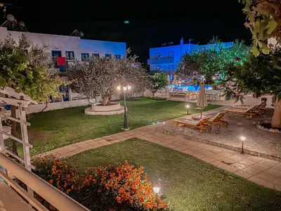 a garden at night with lights and a park at Lindos Athena in Líndos