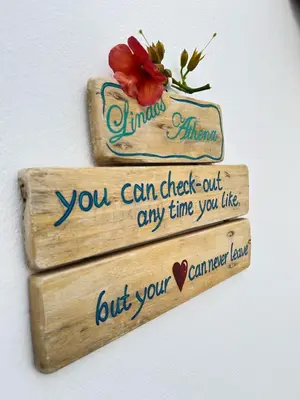 a sign that says you can check out any time you like at Lindos Athena in Líndos