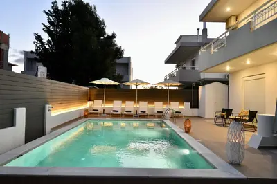 a swimming pool in the backyard of a house at Angels Villa in Kremasti