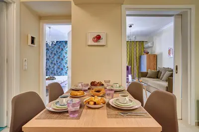 a table with food on it in a living room at Academia in Rhodes Town