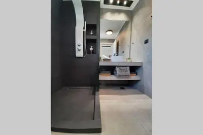 a hallway with a sink and a counter in a room at Luxury 1 bedroom apartment in Ialysos in Ialyssos