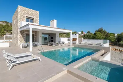 a villa with a swimming pool and a patio at VILLA IRIS in PEFKOS, PINE VILLAS in Pefki Rhodes
