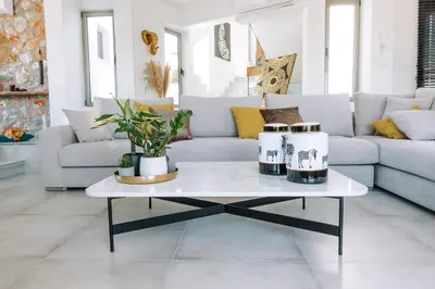 a living room with a couch and a coffee table at Brillante Villa in Ialyssos