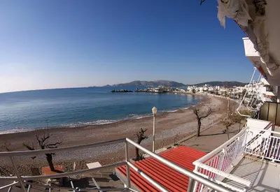 a view of a beach from a balcony at Aegean Seaview in Haraki