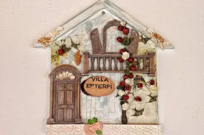 a drawing of a christmas house with a door at Traditional Villa Efterpi in Halki